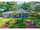 Charming single-story home with a manicured lawn and inviting front porch swing at 102 Cottonwood Dr, Summerville, SC 29483