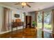 Bright living room with hardwood floors and sliding doors that leads to the backyard at 102 Cottonwood Dr, Summerville, SC 29483