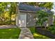 This shed is located in the backyard and is accessible by a stone path and has plenty of storage at 102 Cottonwood Dr, Summerville, SC 29483