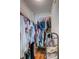 Bright walk-in closet with built-in shelving provides ample storage space for clothes and shoes at 102 Cottonwood Dr, Summerville, SC 29483