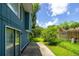 Inviting backyard patio area with lush landscaping and mature trees at 104 Queens Ct, Summerville, SC 29485
