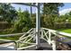 View from the porch of the backyard featuring a blackstone grill and well-maintained lawn with perimeter fencing at 104 Queens Ct, Summerville, SC 29485