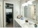 Well-lit bathroom featuring a spacious vanity with great lighting and view to bedroom at 104 Queens Ct, Summerville, SC 29485