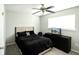 A cozy bedroom featuring a ceiling fan, window with blinds, and dark dresser with a television on top at 104 Queens Ct, Summerville, SC 29485
