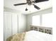 Bright bedroom with a view of a closet and window, featuring a ceiling fan and patterned cabinet at 104 Queens Ct, Summerville, SC 29485