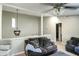 Cozy living room featuring neutral walls, comfortable seating, and a stylish ceiling fan at 104 Queens Ct, Summerville, SC 29485