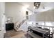Open living area with high ceilings and a modern chandelier, adjacent to the staircase at 104 Queens Ct, Summerville, SC 29485
