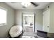 Bright office offers view of a living area, neutral walls, and a ceiling fan, creating a productive atmosphere at 104 Queens Ct, Summerville, SC 29485