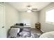 Bright office with a functional desk space, neutral walls, and a ceiling fan, creating a productive atmosphere at 104 Queens Ct, Summerville, SC 29485