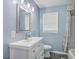 Bathroom features a white vanity, framed mirror, modern lighting, and shower/tub combo at 108 Reardon St, Moncks Corner, SC 29461