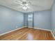 Bedroom features wood floors, a ceiling fan, light blue walls and ample natural light at 108 Reardon St, Moncks Corner, SC 29461