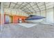 Open carport with a covered boat featuring a gravel base and metal framing at 108 Reardon St, Moncks Corner, SC 29461