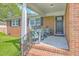 Inviting front porch with chairs, perfect for relaxing and enjoying the outdoors at 108 Reardon St, Moncks Corner, SC 29461