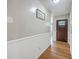A welcoming entrance hall with wood floors and traditional wainscoting at 108 Reardon St, Moncks Corner, SC 29461