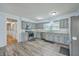 This eat-in kitchen features grey cabinets, stainless steel appliances, and modern tile floors at 108 Reardon St, Moncks Corner, SC 29461