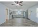 A well-lit, eat-in kitchen features grey cabinets, stainless steel appliances and wood-look tile floors at 108 Reardon St, Moncks Corner, SC 29461