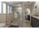Bright bathroom features glass shower, double sink and vanity at 109 Carolina Blvd, Isle of Palms, SC 29451