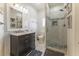 Beautiful bathroom with tiled shower, updated vanity, and nice lighting at 109 Carolina Blvd, Isle of Palms, SC 29451