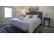 Comfortable bedroom features a large window for natural light and a navy blue side table at 109 Carolina Blvd, Isle of Palms, SC 29451