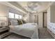 Bright bedroom features large windows, ceiling fan and ensuite bathroom at 109 Carolina Blvd, Isle of Palms, SC 29451