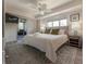Bright bedroom features large windows, ceiling fan, ensuite bathroom and lounge at 109 Carolina Blvd, Isle of Palms, SC 29451