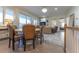 Bright dining area open to the living room with a large window offering a view at 109 Carolina Blvd, Isle of Palms, SC 29451