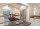 Bright kitchen features granite countertops, stainless steel appliances, and modern fixtures at 109 Carolina Blvd, Isle of Palms, SC 29451