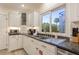 Bright kitchen features granite countertops, stainless steel appliances, and a view of the outside at 109 Carolina Blvd, Isle of Palms, SC 29451