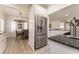 Bright kitchen features granite countertops, stainless steel appliances, and open to the dining area at 109 Carolina Blvd, Isle of Palms, SC 29451