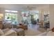 Open living room with large TV, comfortable seating, and bright decor at 109 Carolina Blvd, Isle of Palms, SC 29451