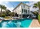 Inviting backyard pool with ample seating areas and sunny skies at 109 Carolina Blvd, Isle of Palms, SC 29451