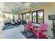 Comfortable porch area with outdoor chairs, outdoor sofas, and ceiling fan at 109 Carolina Blvd, Isle of Palms, SC 29451