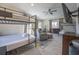 Charming room with twin bunk beds, sitting area, and TV at 109 Carolina Blvd, Isle of Palms, SC 29451