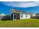 Spacious backyard featuring solar panels on the roof and a screened porch at 109 Lyra Ln, Summerville, SC 29486