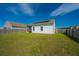 Well-maintained backyard featuring solar panels on the roof and a privacy fence at 109 Lyra Ln, Summerville, SC 29486