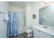 Bright bathroom with a shower-tub combination, white vanity, and a well-lit mirror at 109 Lyra Ln, Summerville, SC 29486