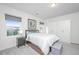 Bright bedroom with large windows, neutral colors, and a spacious closet at 109 Lyra Ln, Summerville, SC 29486