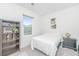 Well-lit bedroom with a comfortable bed, shelving, and window offering plenty of natural light at 109 Lyra Ln, Summerville, SC 29486