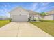 Beautiful home featuring a well-maintained lawn, attached garage, and cozy front porch at 109 Lyra Ln, Summerville, SC 29486