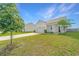Charming home with a well-manicured lawn, a paved driveway, and an attached two-car garage at 109 Lyra Ln, Summerville, SC 29486