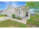 Charming home featuring a well-maintained lawn, attached garage, and cozy front porch at 109 Lyra Ln, Summerville, SC 29486