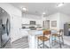 Modern kitchen with granite countertops, stainless steel appliances, and bar stool seating at 109 Lyra Ln, Summerville, SC 29486