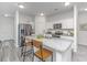 Bright kitchen featuring white cabinetry, a granite island with seating, and stainless steel appliances at 109 Lyra Ln, Summerville, SC 29486