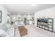 Spacious living room with neutral tones, plush carpeting, and an open concept design at 109 Lyra Ln, Summerville, SC 29486