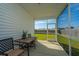 Charming screened porch with a table and chairs, perfect for enjoying the outdoors at 109 Lyra Ln, Summerville, SC 29486