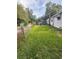 Spacious backyard view showcasing a car port behind the home at 1124 Davidson Ave, Charleston, SC 29407