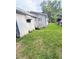Exterior shot of the home revealing the backyard and awning covered entrance at 1124 Davidson Ave, Charleston, SC 29407