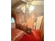 Bedroom featuring wood paneling, ornate light fixture, and dated decor at 1124 Davidson Ave, Charleston, SC 29407