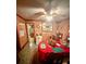 Inviting dining room featuring wood paneling, an adjacent galley kitchen, and vintage decor at 1124 Davidson Ave, Charleston, SC 29407