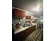Galley kitchen featuring dated appliances, decorative elements, and neutral walls at 1124 Davidson Ave, Charleston, SC 29407
